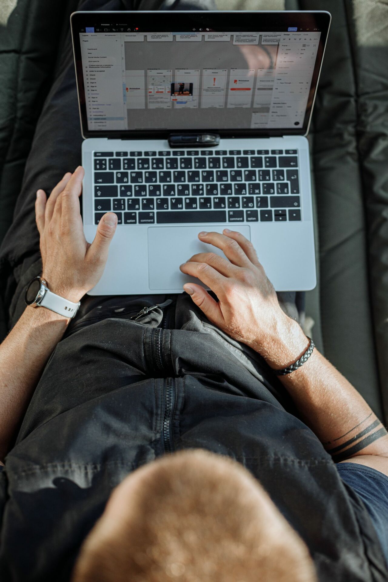 Free A Person Working on His Laptop Stock Photo