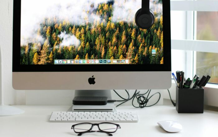 Free Stylish home office workspace featuring a computer setup with accessories. Stock Photo