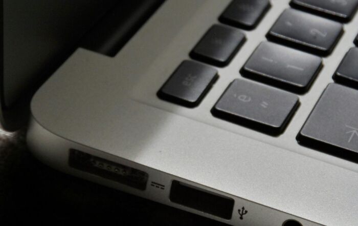 Free Detailed view of a silver laptop showing keyboard and multiple ports. Stock Photo